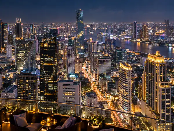 Night view over Silom and Sathorn from a tall tower bar