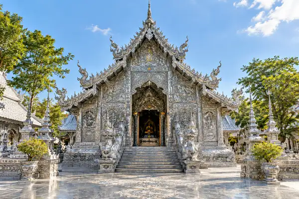 Temple hall covered in fine silver relief work in bright sun