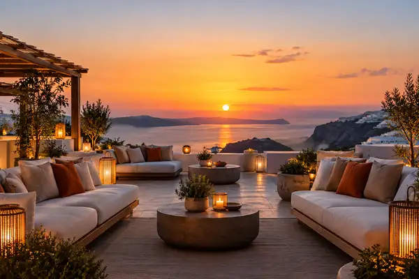 Indy Massage Pattaya: rooftop lounge at sunset with cushioned sofas, lanterns and a wide sea view