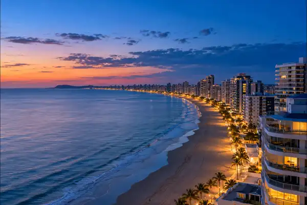 Indy Massage Pattaya: Jomtien beach coast line from a rooftop at blue hour with a calm sea