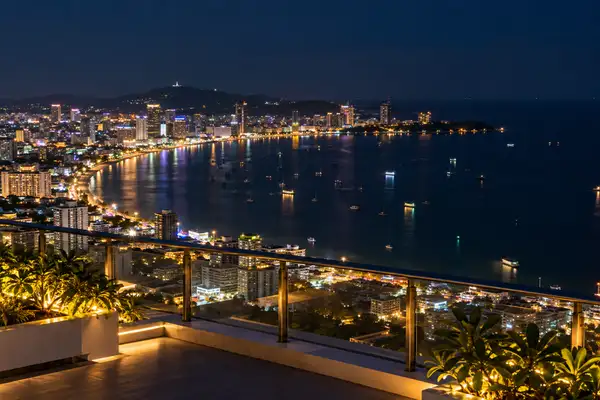 Indy Massage Pattaya: Pattaya city lights seen from a rooftop at night with soft bokeh