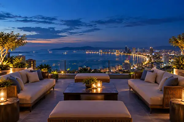 Indy Massage Pattaya: sky bar terrace on a high hotel floor with a glass rail and sea view over Pattaya