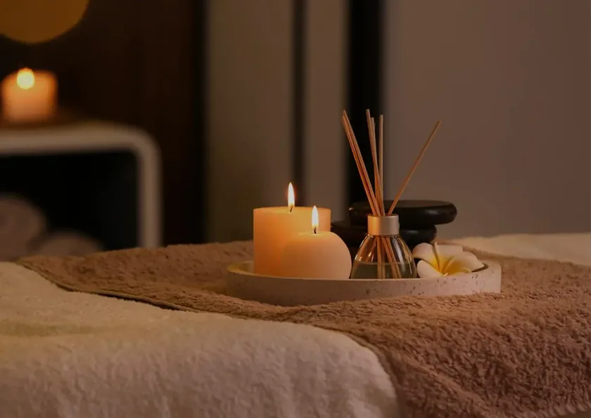 Warm oil and candle setup prepared for a Thai massage booking in Bangkok