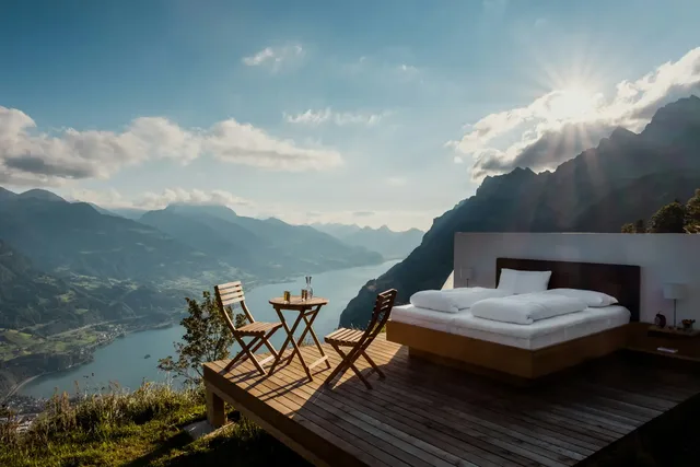 Luxury open-air bedroom with mountain and lake views